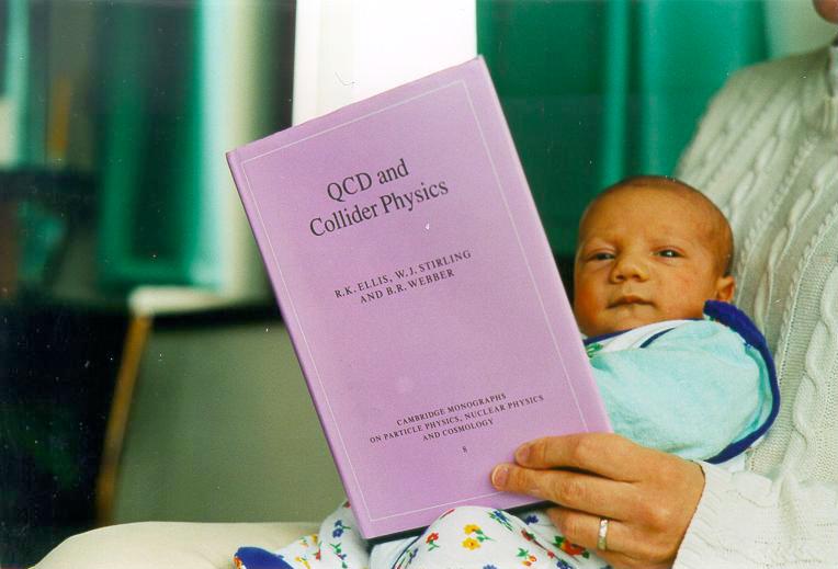James Stirling baby boy reading QCD and Collider Physics book.jpg